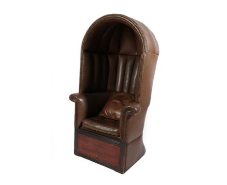 A Porter's Chair, 19th century, with arched canopy and flared rounded back, the seat with squab cushion over a hinged compart