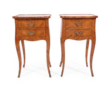 A Pair of French 19th Century Tulipwood Petit Commodes, possibly North Italian, the shaped quarter veneered top above two dra