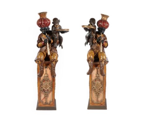 A Pair of Venetian Polychrome Decorated and Parcel Gilt Blackamoor Figures, late 19th century, each figure inset with glass e