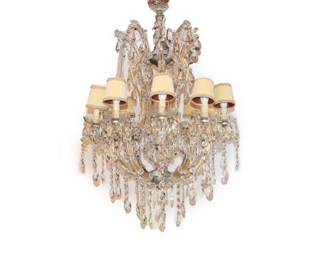 A Cut Glass Ten-Light Chandelier, in Victorian style, the scroll branches hung with faceted swags and drops, 120cm high