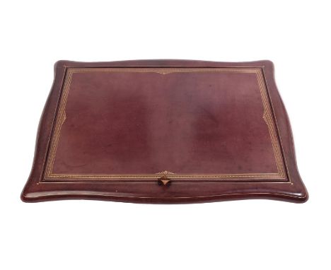 Asprey &amp; Co Ltd London: A Red Leather Desk Blotter, of serpentine shaped form, with reversible blotting pad, 57cm by 40cm