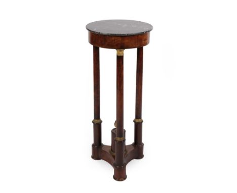 A French Mahogany Gueridon, mid 19th century, the circular bardiglio marble top above column supports with gilt cast mounts, 