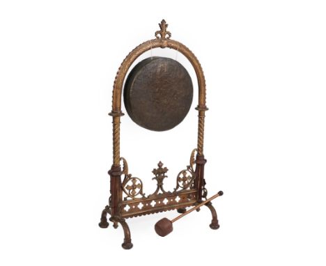 A Victorian Cast Metal Dinner Gong, 3rd quarter 19th century, the moulded frame with egg and dart border and spiral turned su