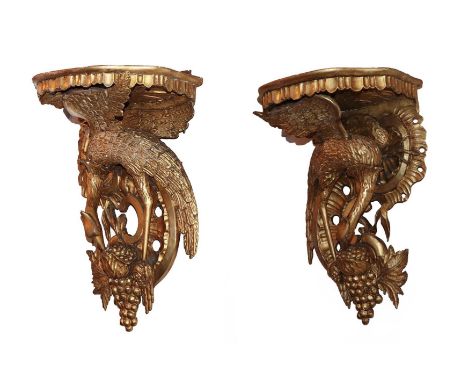 A Pair of Victorian Giltwood Wall Brackets, the serpentine shaped shelf supported by a bird with outstretched wings and C scr