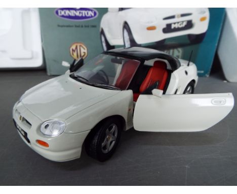 Corgi - A boxed Corgi 1:18 scale diecast #95100 MGF in white. The model which has its mirrors fitted appears to be in Mint co