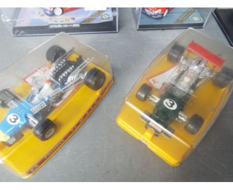 Vitesse - Trofeu - Politoys - A collection of 14 boxed racing cars in various scales including Politoys # F1 Jackie Stewart M
