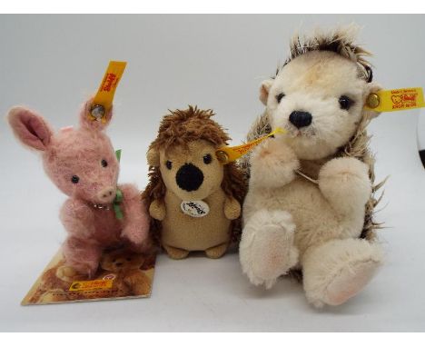 Steiff Animals - a Steiff Pig #040320 with button and yellow label, Hedgehog #112164 with button and yellow label and a Porcu
