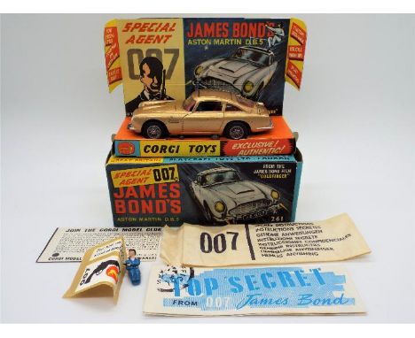 Corgi Toys - A boxed Corgi #261 James  Bond’s Aston Martin DB5. The model in gold with red interior and wire wheels, appears 