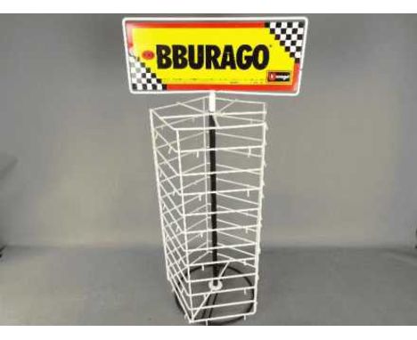 Bburago - A metal pentagonal point of sale Bburago branded display stand. The revolving stand with revolving top is designed 