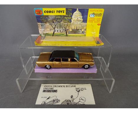 Corgi Toys - A boxed Corgi Toys #262 Lincoln Continental Executive Limousine . The model in gold with black roof, spun hubs f