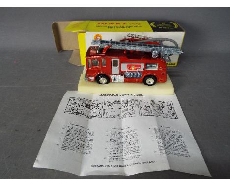 Dinky Toys - A boxed Dinky Toys #285 Merryweather Marquis Fire Tender. The appliance in metallic red and silver, chrome escap