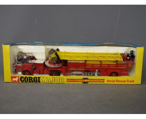 Corgi Toys - A boxed Corgi #1143 American LaFrance Aerial Rescue Truck. The model in red with yellow ladder and chrome platfo