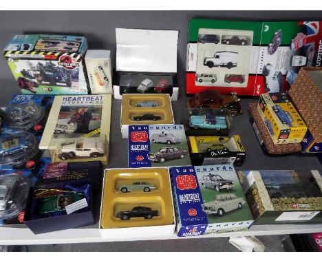 Corgi - Lledo - Solido - A collection of over 20 boxed diecast cars in various scales and also seven empty car boxes. Lot inc