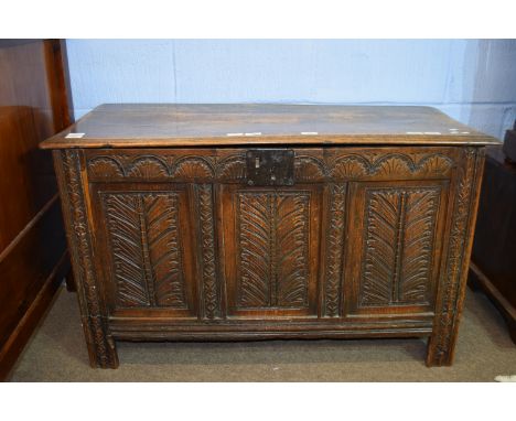 Oak coffer with three panel front and plain interior on stile feet 109cm wide