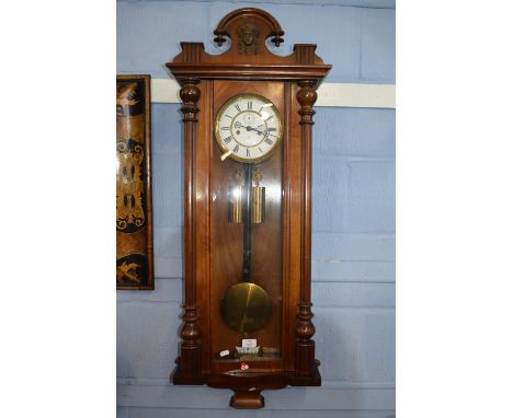 Vienna type wall clock of typical form in decoratively carved mahogany case, the dial signed GB, with secondary dial (hand ab