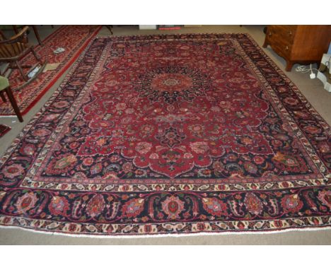 Large red ground Persian Mashad Carpet, mutlicoloured with traditional design&nbsp;388cm x 270cm approx&nbsp;