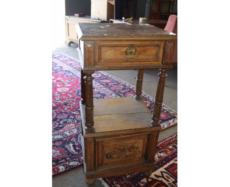 Late Victorian walnut bedside stand with inset veined marble top above a single drawer, open section to centre with four flut
