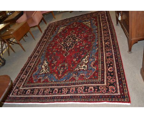 Rich red ground full pile Persian Serouke Carpet, floral medallion design 296cm x 200cm approximately&nbsp;