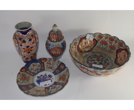 Group of Japanese porcelain with Imari designs comprising a shaped bowl, further small dish, a vase and small vase and cover 