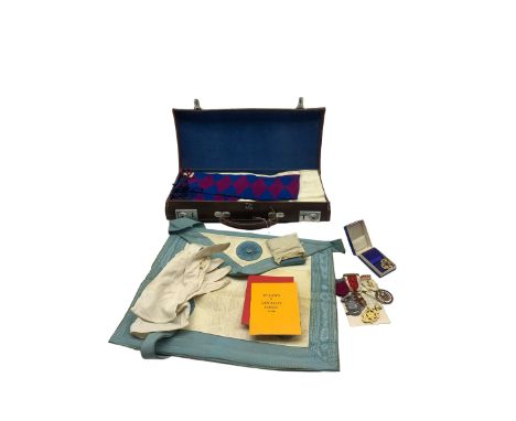 Suitcase and contents of Masonic regalia, silk and leather apron, sash, booklets etc