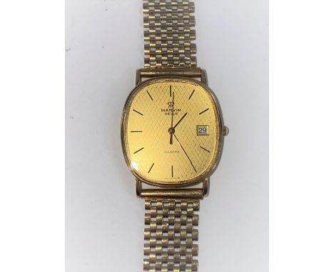 A gent's Marvin wristwatch on 9 carat hallmarked gold gate type strap.&nbsp;In good condition, 4 screw heads, somewhat marked