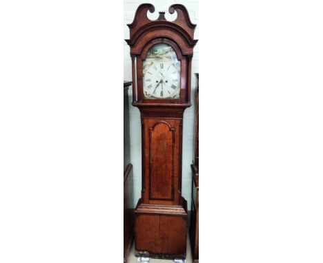 An early 19th century oak longcase clock with mahogany crossbanding, the hood with arched dentil cornice and swan neck pedime