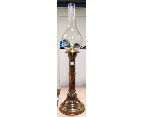 A 19th century spring loaded brass candle lamp and shade 