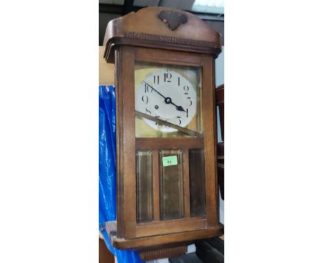 A 1930's striking wall clock; a marble light bowl 