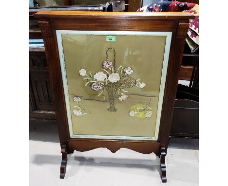 An Edwardian mahogany firescreen with ribbon work panel 