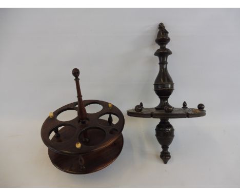 An early Victorian treen cruet or spice stand together with an oak hanging spoon rack.