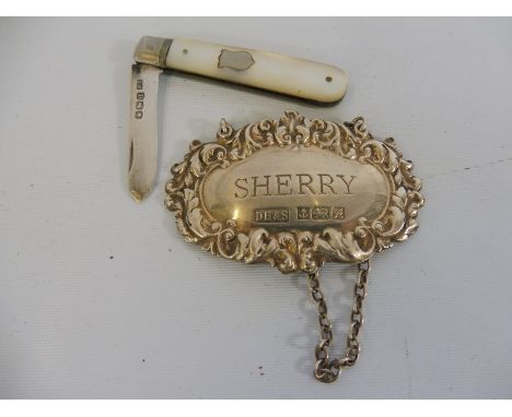 A small MOP handled silver fruit knife and a silver Sherry decanter label, Birmingham 1975.