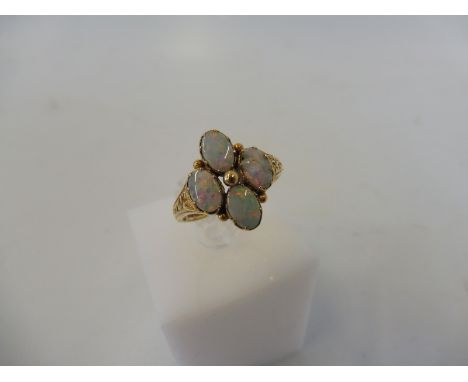 A 9ct gold and opal ring, one of the four stones is damaged, weight approx. 3g.