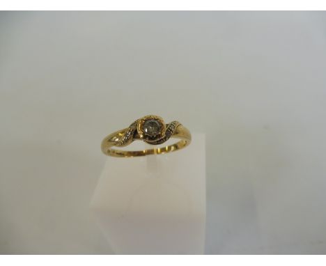 A 9ct gold ring set with a central diamond, weight approx. 2g.