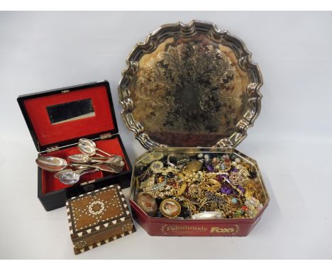 Two boxes of assorted costume jewellery, a quantity of silver plated spoons, jewellery boxes etc. 