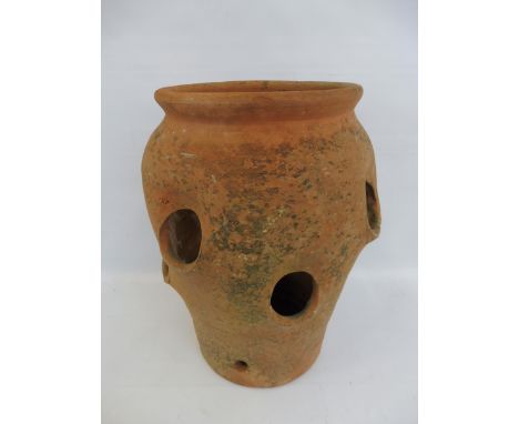 A weathered terracotta strawberry planter, 16" h.