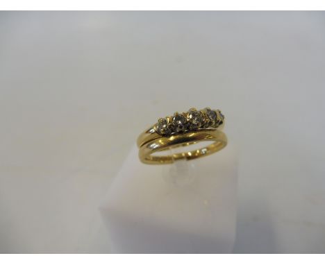 A 9ct gold wedding band and a 9ct and diamond engagement ring, weight approx. 3g.