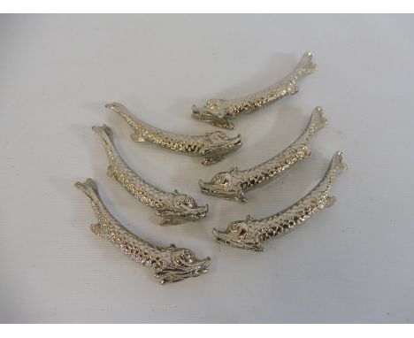 A set of six unusual silver plated knife rests in the form of fish.