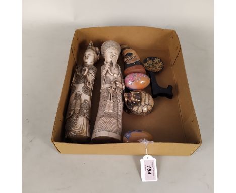 A selection of oriental style items including a pair of resin figures, a horn style dragon, resin mythical creature etc