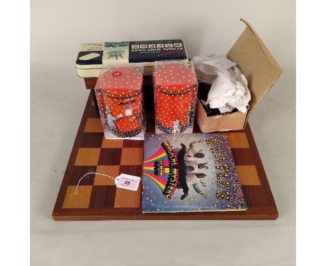 A chess set and board, a selection of vintage tins and the cover only of The Beatles Magical Mystery Tour single