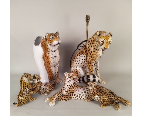 Italian porcelain figures of a seated cheetah lamp base and a cheetah umbrella stand (tiny chip to ear) plus two leopard cubs