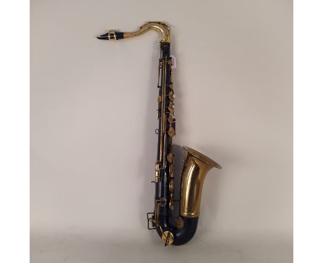 A vintage O Borgani saxophone in two tone brass and black (pitting to brass ware and signs of age and use), approx 33" long