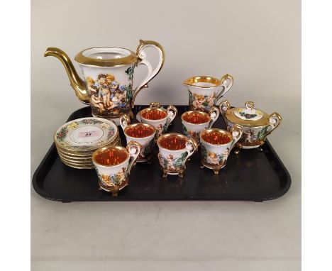 A Capodimonte fifteen piece tea set with embossed flowers and figures with gilded decoration