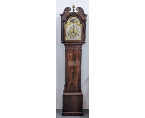 A George III Mahogany 8 day longcase clock, the case having a broken swan neck pediment with pierced fretwork, two reeded col