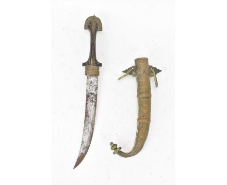 A 19th century Moroccan dagger Jambiya (or Koummya) having a curved blade with a brass engraved scabbard, dagger length 38cm,