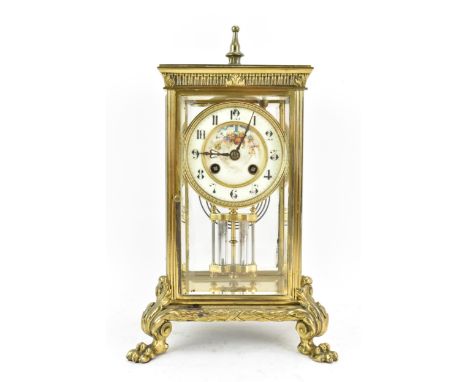 A late 19th century French gilt metal and beveled glass mantle clock, the dial having a floral painted centre surrounded by a