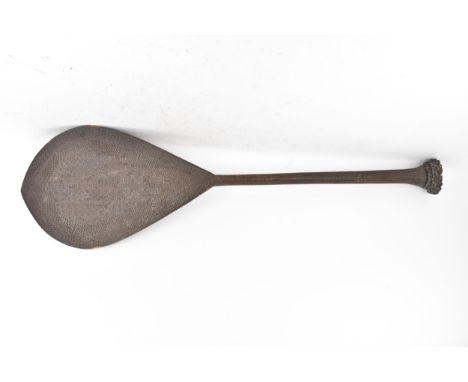 An Austral Islands French Polynesia ceremonial treen paddle, heavily carved with geometric designs covering the entire piece,