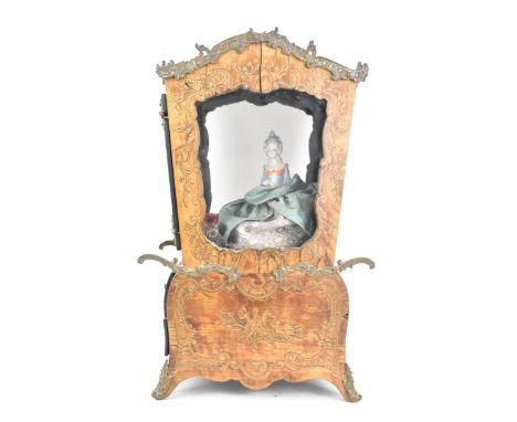 A 19th century French marquetry inlaid model of a sedan chair, applied with gilt metal scroll mounts and inlaid with shell, C