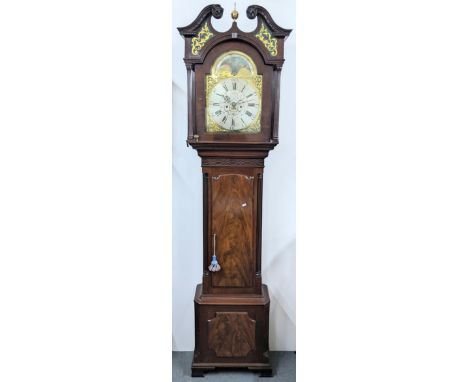 A George III mahogany 8 day longcase clock, the case having a broken swan neck pediment with painted scroll panels, two reede