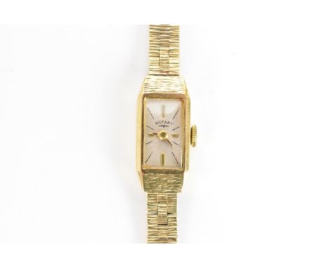 A Rotary, manual wind, ladies, 9ct gold wristwatch, having a rectangular dial with baton markers, on a integral 9ct gold bark
