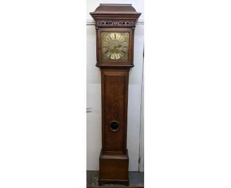 A George II oak cased 30 hour longcase clock, having a moulded cornice, pierced fretwork above turned columns flanking the sq